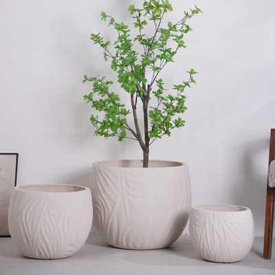 Αγορά neutral beige round fiber clay planter with irregular wavy lines pattern lightweight durable low-maintainence flower pot holiday Villa hotel shopping mall office decoration garden landscaping project online manufacture